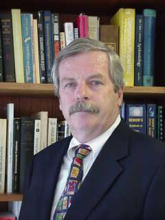 Photograph of Dan Napier in his library
